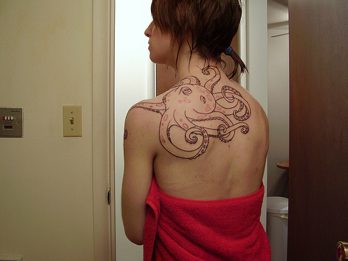 Awesome Octopus Tattoo On Women Upper Back