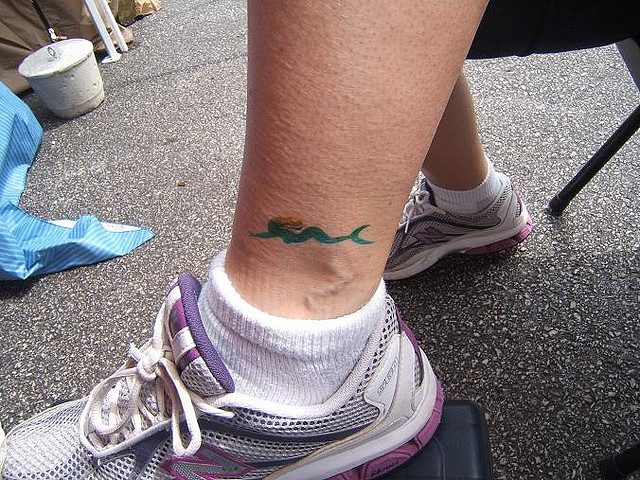 Awesome Small Mermaid Tattoo On Left Ankle