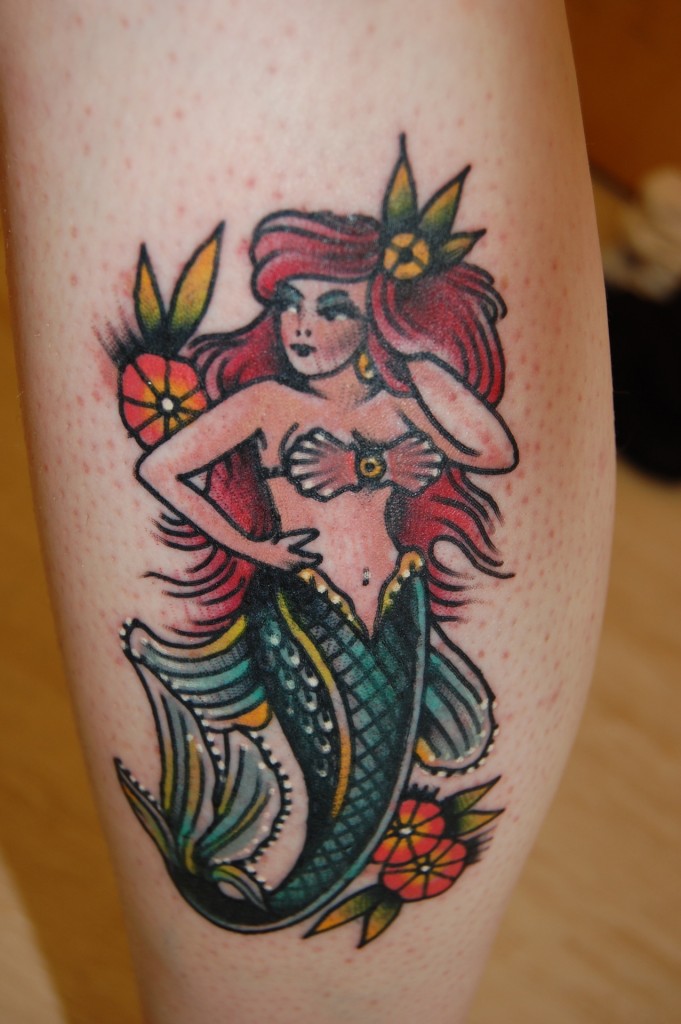Awesome Traditional Mermaid With Flowers Tattoo Design For Leg Calf