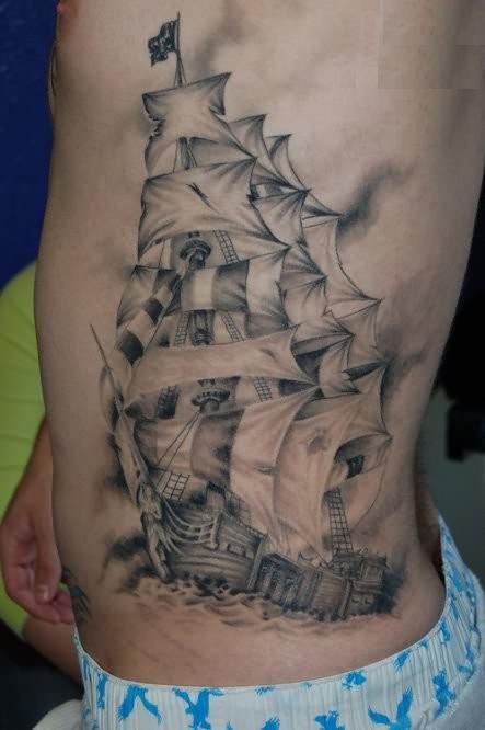 Black And Gery Pirate Ship With Anchor Tattoo On Man Left Side Rib