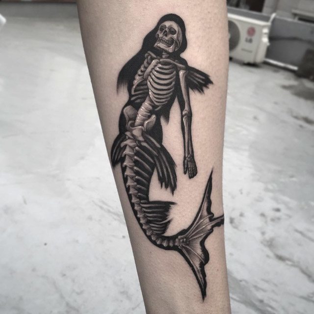 Black And Grey 3D Mermaid Skeleton Tattoo Design For Forearm By Gara