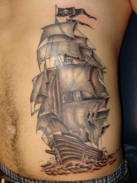 Black And Grey Ghost Pirate Ship Tattoo On Man Left Side Rib