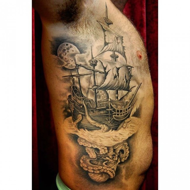Black And Grey Ghost Pirate Ship With Octopus Tattoo On Man Right Side Rib
