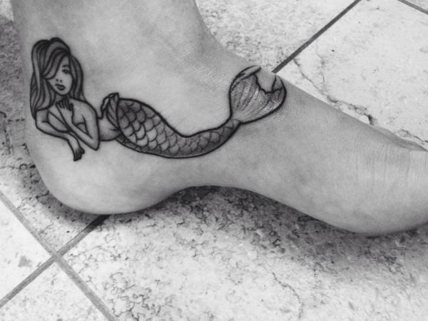 Black And Grey Mermaid Tattoo On Left Foot Ankle