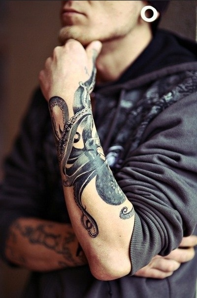 Black And Grey Octopus Tattoo On Man Left Arm