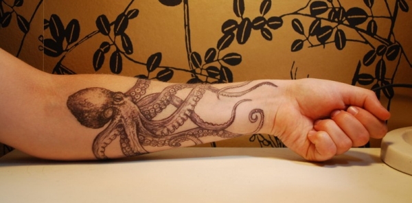Black And Grey Octopus Tattoo On Women Left Forearm