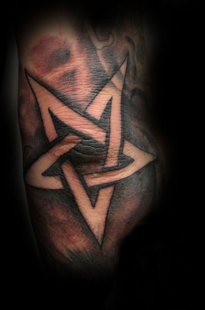 Black And Grey Outline Star Tattoo On Elbow