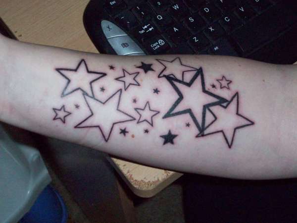 Black And Grey Outline Star Tattoos On Arm
