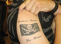 Black And Grey Pirate Flag Tattoo On Man Right Half Sleeve