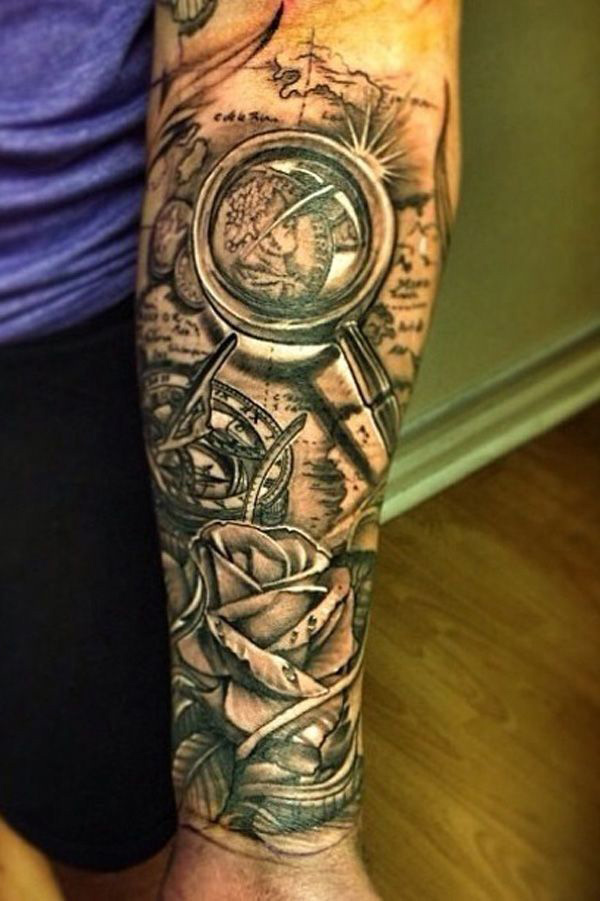 Black And Grey Pirate Map With Rose And Compass Tattoo On Forearm