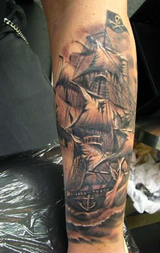 Black And Grey Pirate Ship Tattoo Design For Forearm