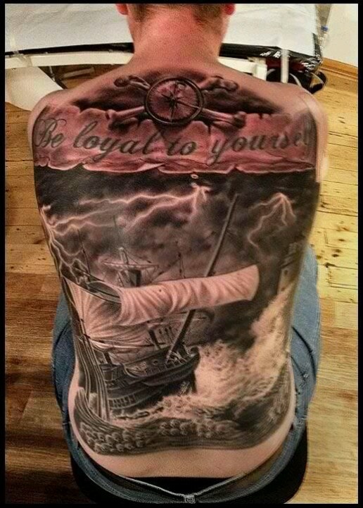 Black And Grey Pirate Ship With Banner Tattoo On Man Full Back
