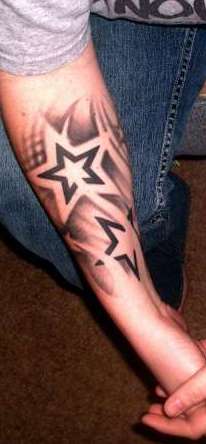 Black And Grey Star Tattoo On Man Right Forearm