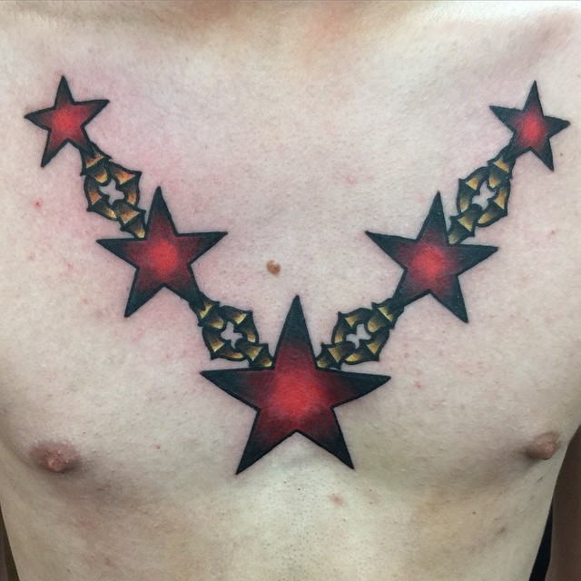 Black And Red Star Tattoos On Chest