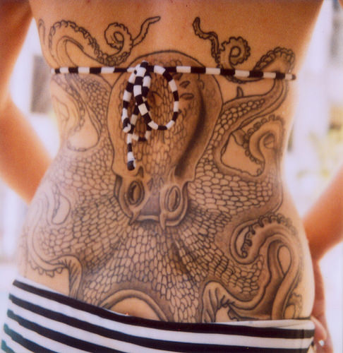 Black And White Octopus Tattoo On Girl Lower Back