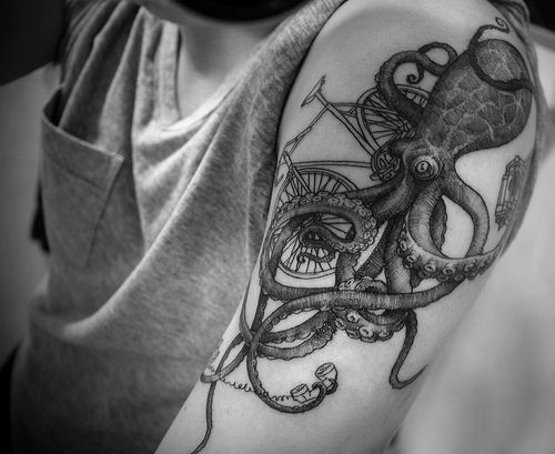 Black And White Octopus With Cycle Tattoo On Left Half Sleeve