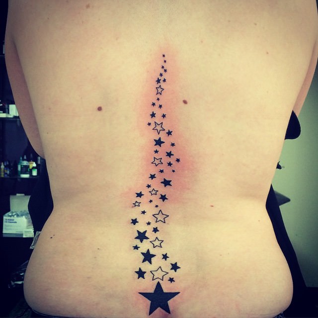 Black And White Star Tattoos On Back Body
