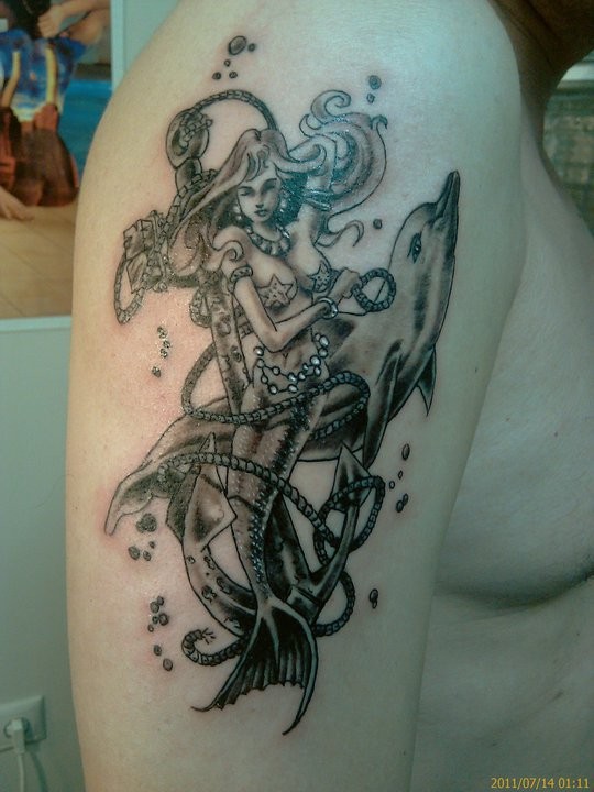 Black Ink Little Mermaid With Anchor And Dolphin Tattoo On Man Right Shoulder By Daequitas