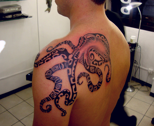 Black Ink Maori Octopus Tattoo On Man Left Back Shoulder