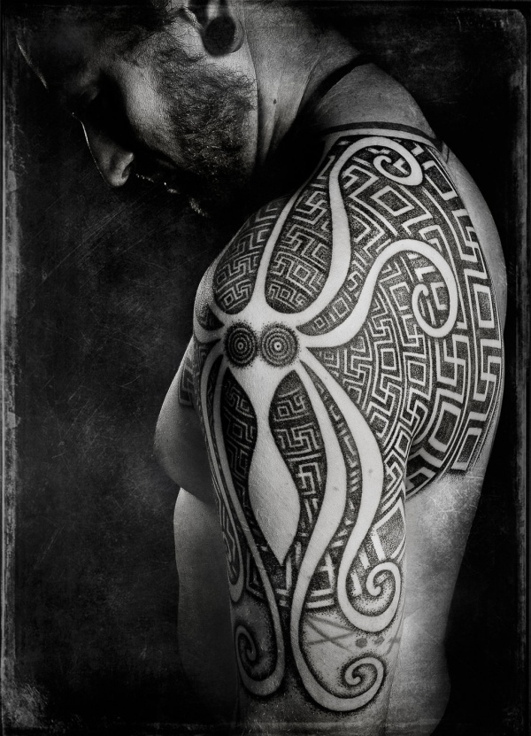 Black Ink Maori Octopus Tattoo On Man Left Shoulder By Peter Blackhand Madsen