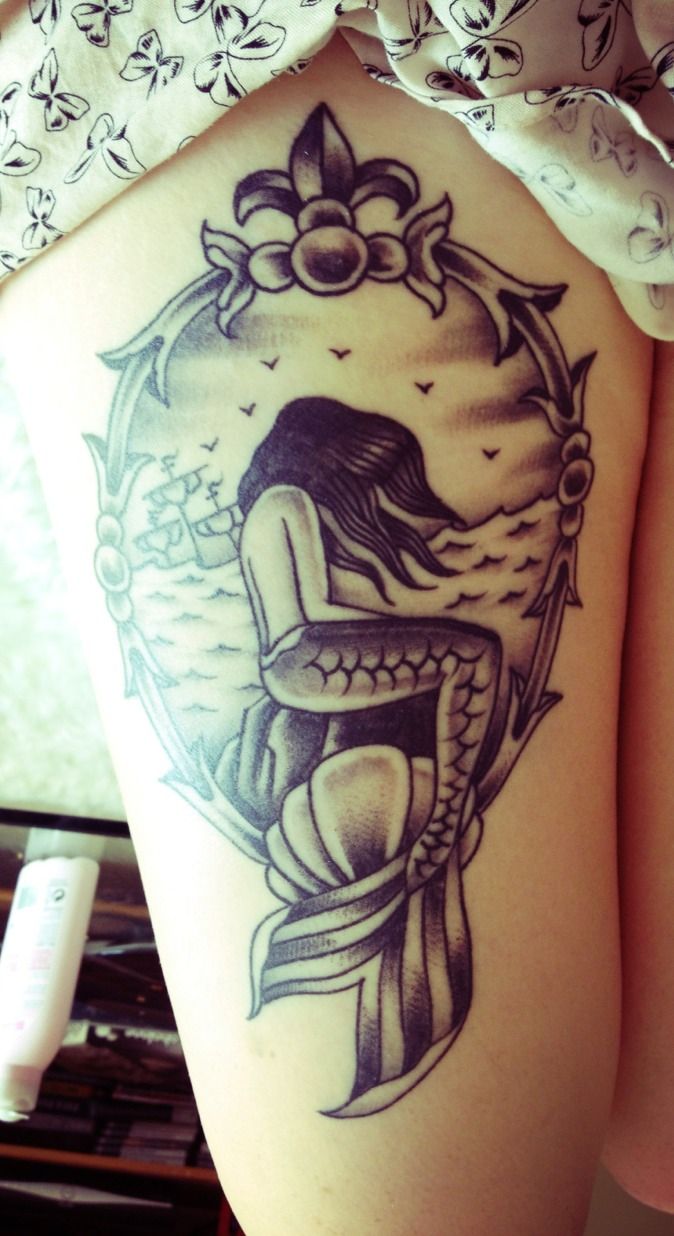 Black Ink Mermaid In Frame Tattoo On Girl Right Thigh