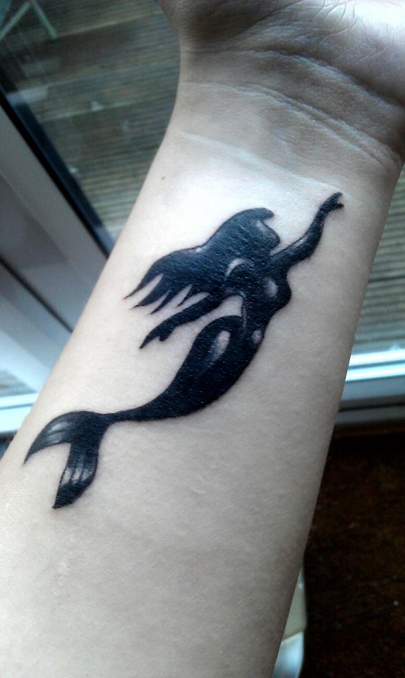 Black Ink Mermaid Tattoo On Left Wrist