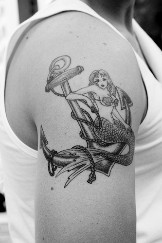 Black Ink Mermaid With Anchor Tattoo On Right Shoulder