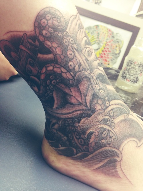 Black Ink Octopus Tattoo On Left Ankle