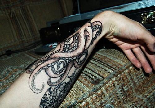Black Ink Octopus Tattoo On Left Arm