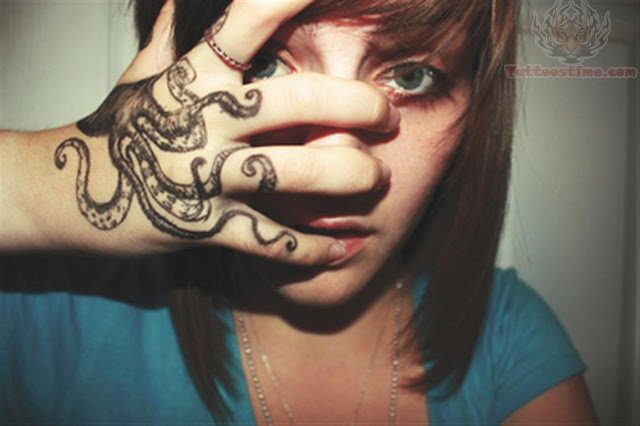 Black Ink Octopus Tattoo On Women Right Hand