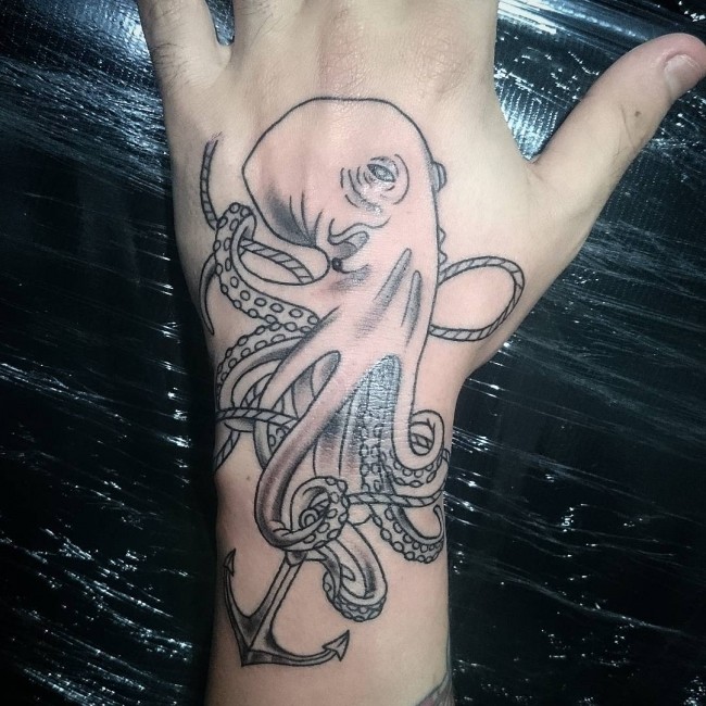 Black Ink Octopus With Anchor Tattoo On Left Hand