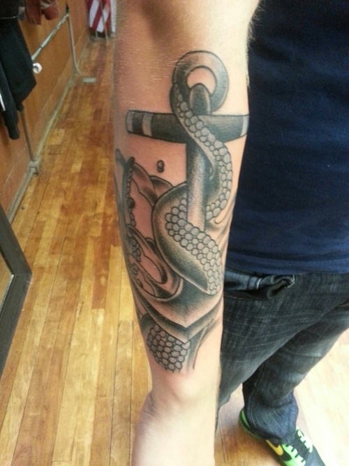 Black Ink Octopus With Anchor Tattoo On Right Arm