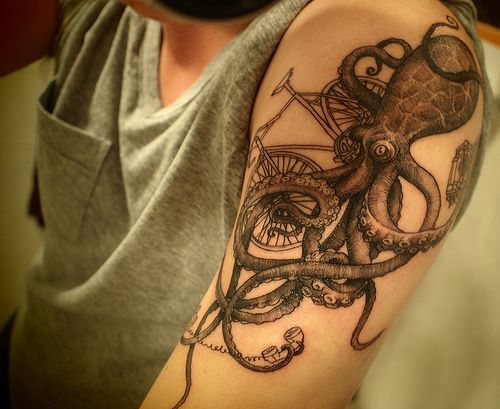 Black Ink Octopus With Cycle Tattoo On Man Left Half Sleeve