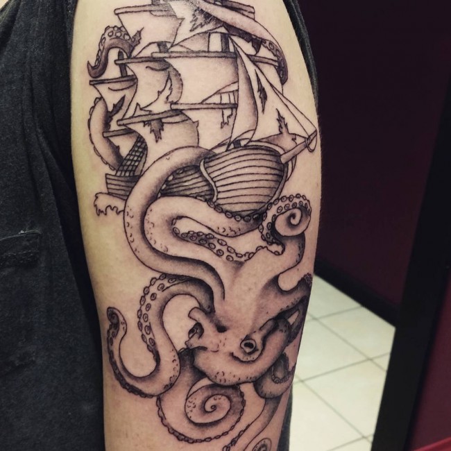Black Ink Octopus With Ship Tattoo On Half Sleeve