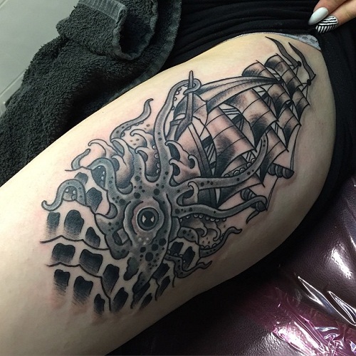 Black Ink Octopus With Ship Tattoo On Left Side Thigh