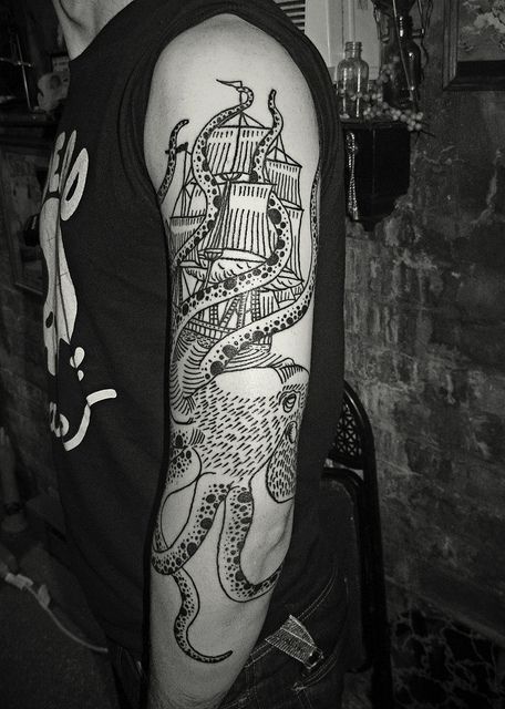 Black Ink Octopus With Ship Tattoo On Man Left Full Sleeve