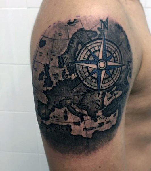 Black Ink Pirate Map With Compass Tattoo On Man Right Shoulder