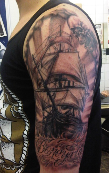 Black Ink Pirate Ship Tattoo On Man Left Half Sleeve