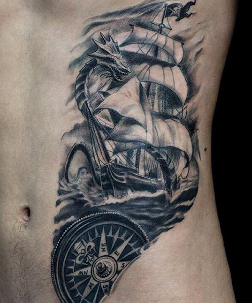 Black Ink Pirate Ship With Dragon And Compass Tattoo On Man Left Side Rib