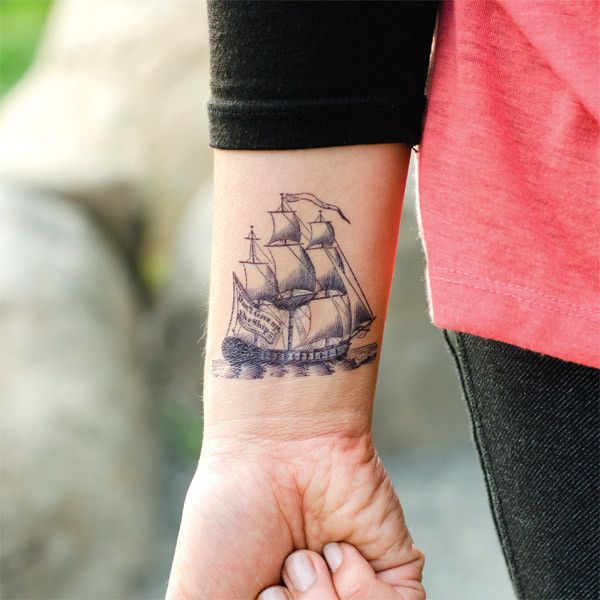 Black Ink Simple Pirate Ship Tattoo On Right Wrist