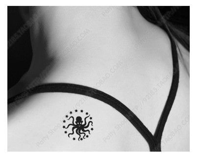 Black Ink Small Octopus Tattoo On Left Back Shoulder