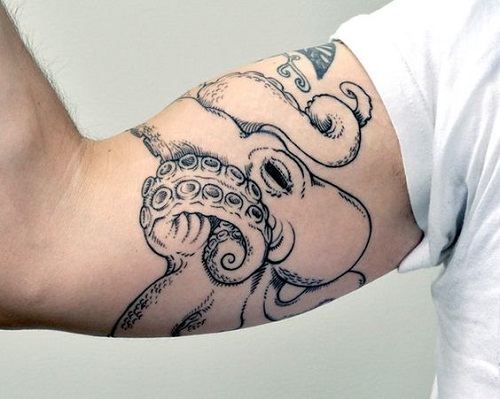 Black Ink Small Octopus Tattoo On Right Bicep