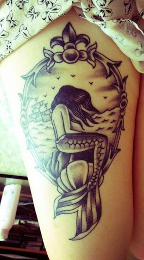 Black Ink Swimming Mermaid In Frame Tattoo On Right Thigh