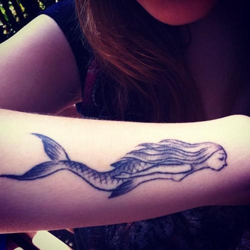 Black Ink Swimming Mermaid Tattoo On Right Arm