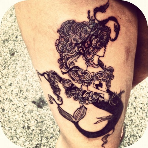 Black Ink Swimming Mermaid Tattoo On Right Thigh