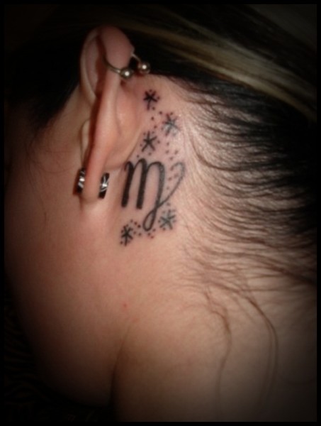 Black Ink Zodiac Virgo Sign And Star Tattoo Behind Ear