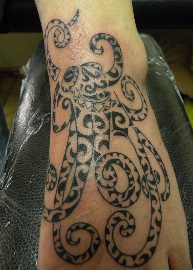 Black Maori Octopus Tattoo On Left Foot