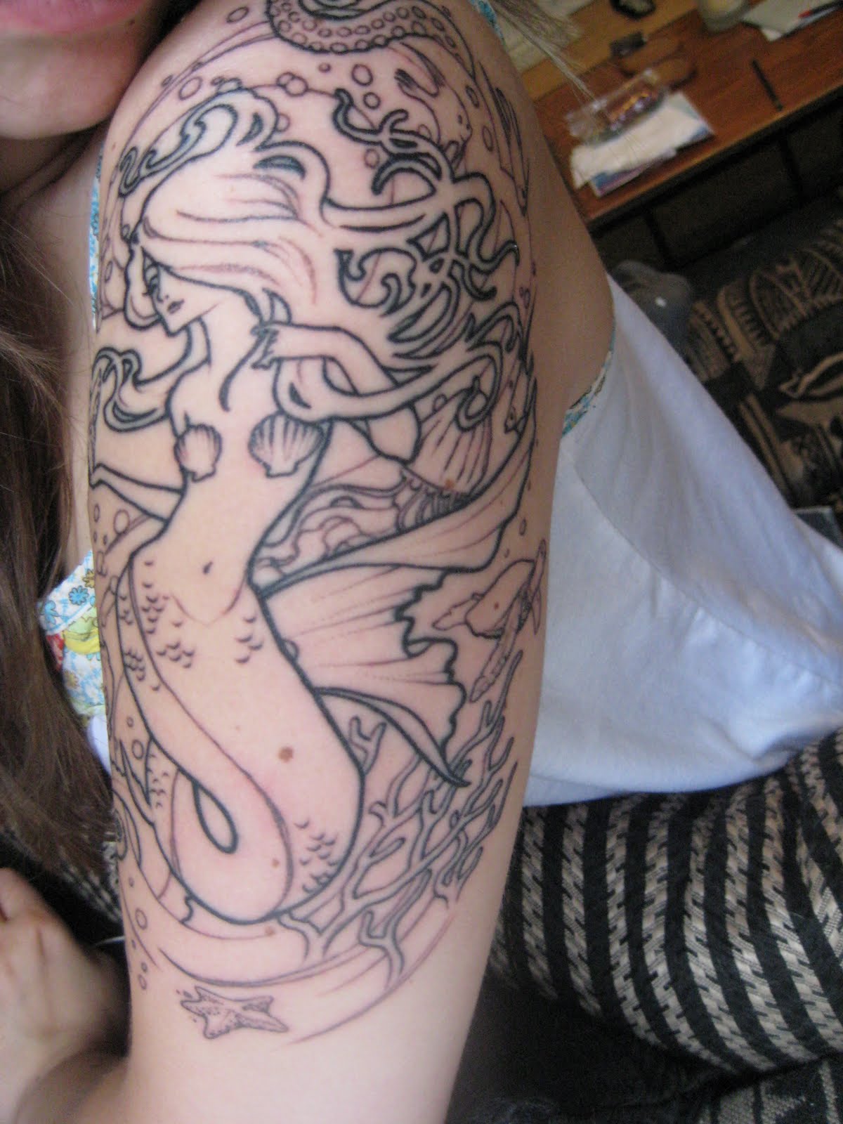 Black Outline Mermaid Tattoo On Girl Left Half Sleeve