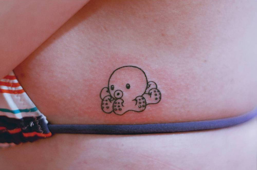 Black Outline Small Octopus Tattoo On Girl Left Side Rib