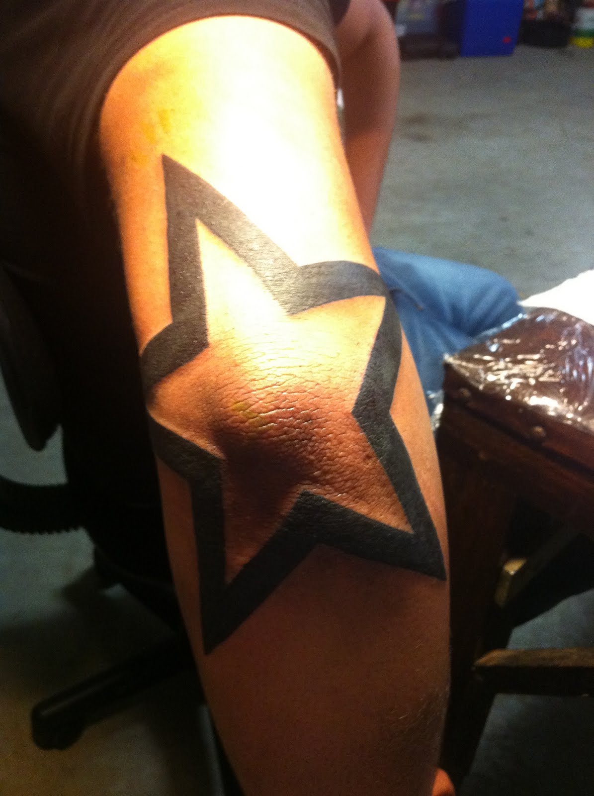 Black Outline Star Tattoo On Elbow